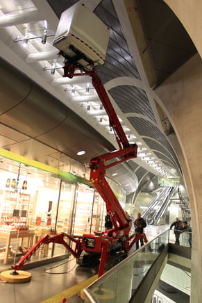 spider-lift-working-in-cramped-atrium-tracked-boom.png