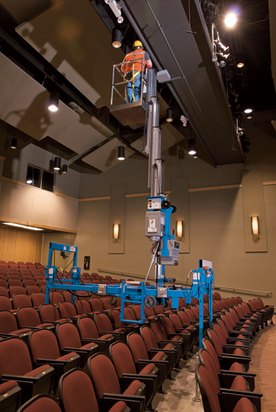 Genie AWP with super straddle working over theatre seating side view