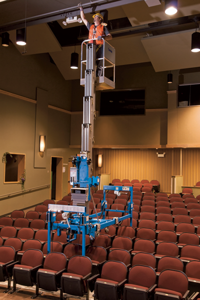 Genie AWP with super straddle working over theatre seating