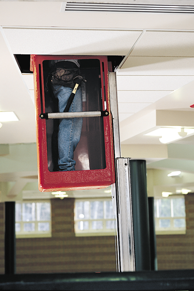 Genie AWP working in a ceiling tile