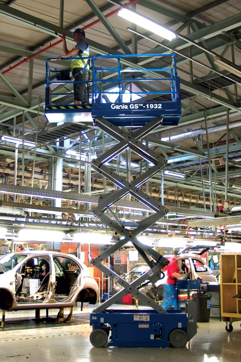 Genie lift GS1932 19ft scissor lift working in car plant