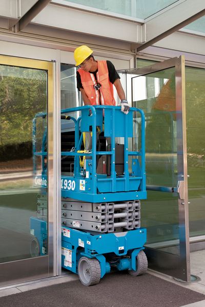 Genie electric scissor lift GS1930 driving through single doorway